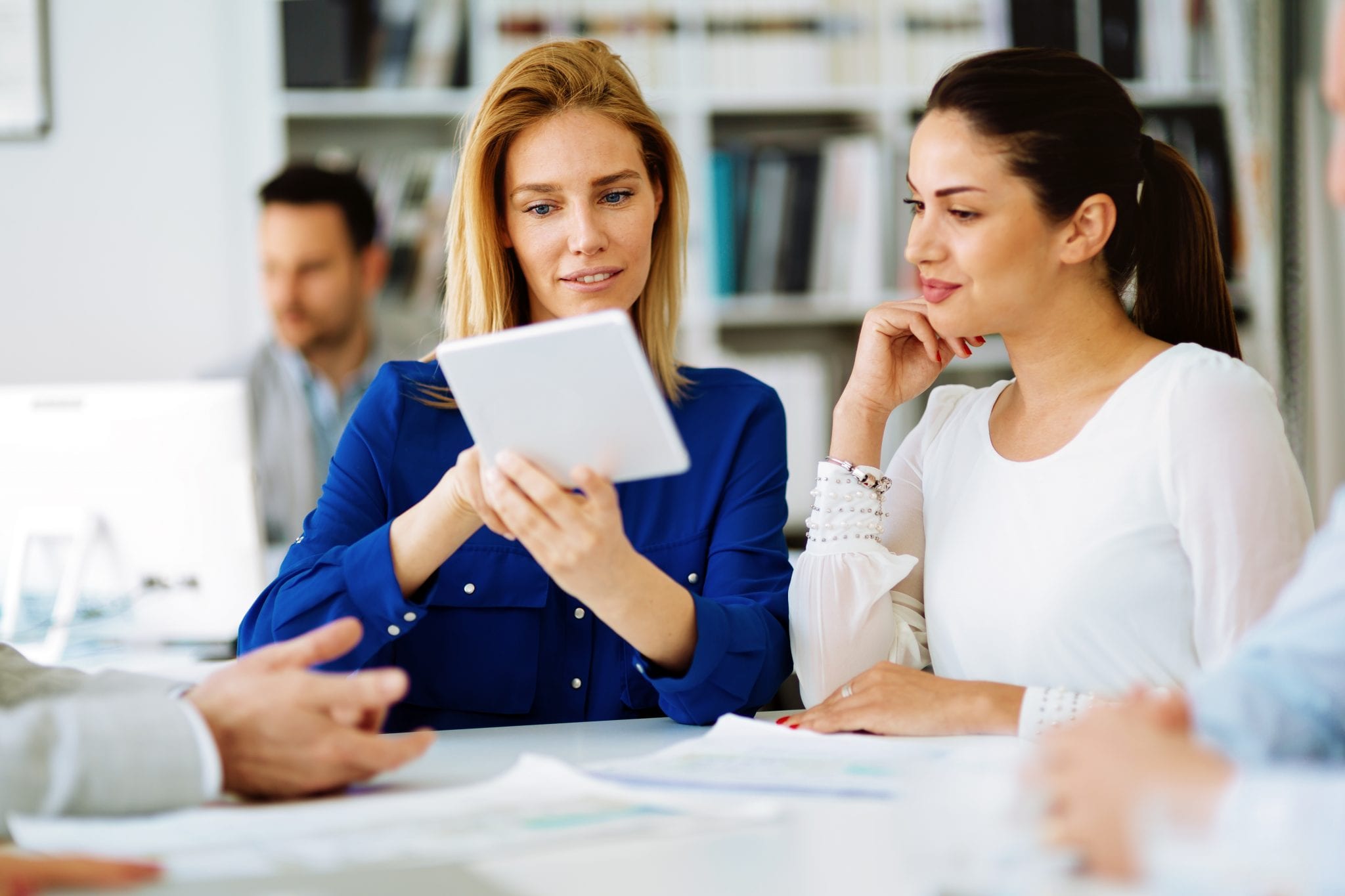 Business people in office holding a conference and discussing strategies