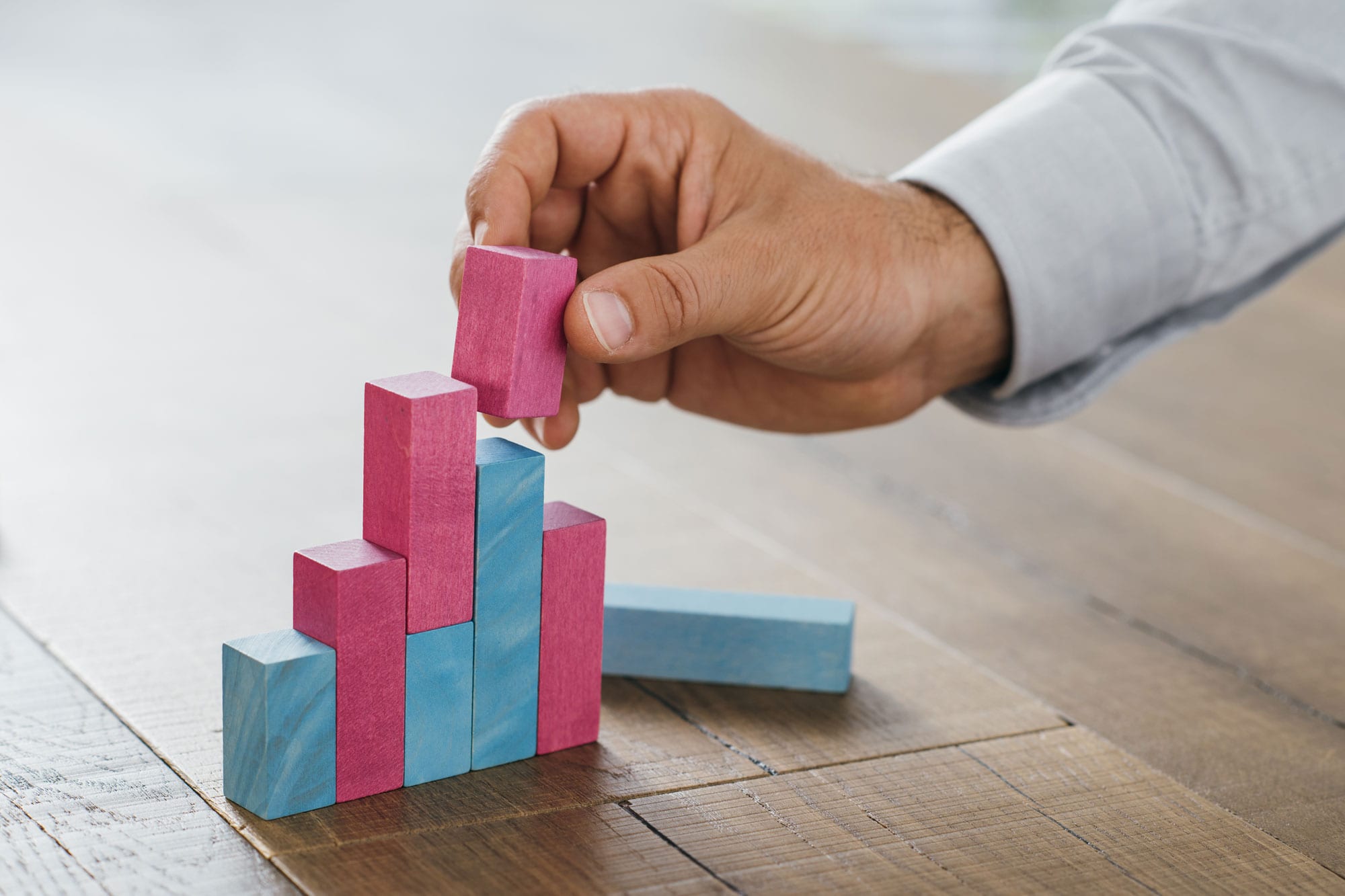 businessman-building-a-successful-financial-graph-P9DNCV2